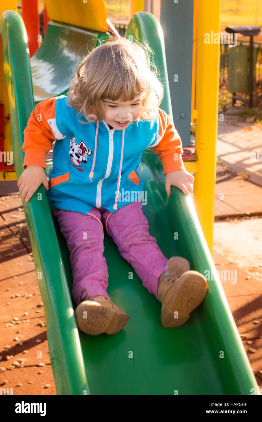 Little Girl Playing At Playground Stock Photo - Alamy