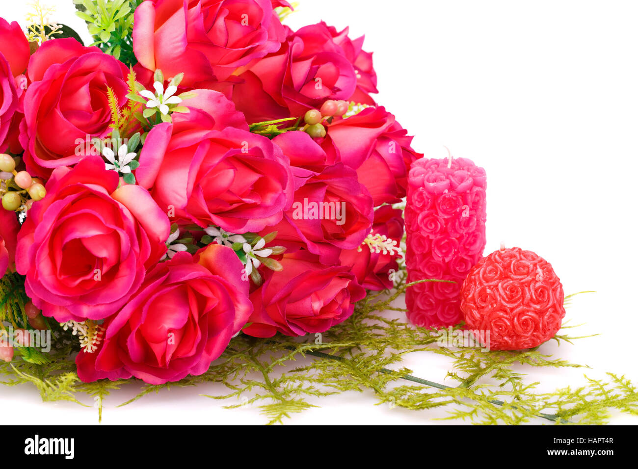 Candles, roses and glass heart isolated on white background Stock Photo