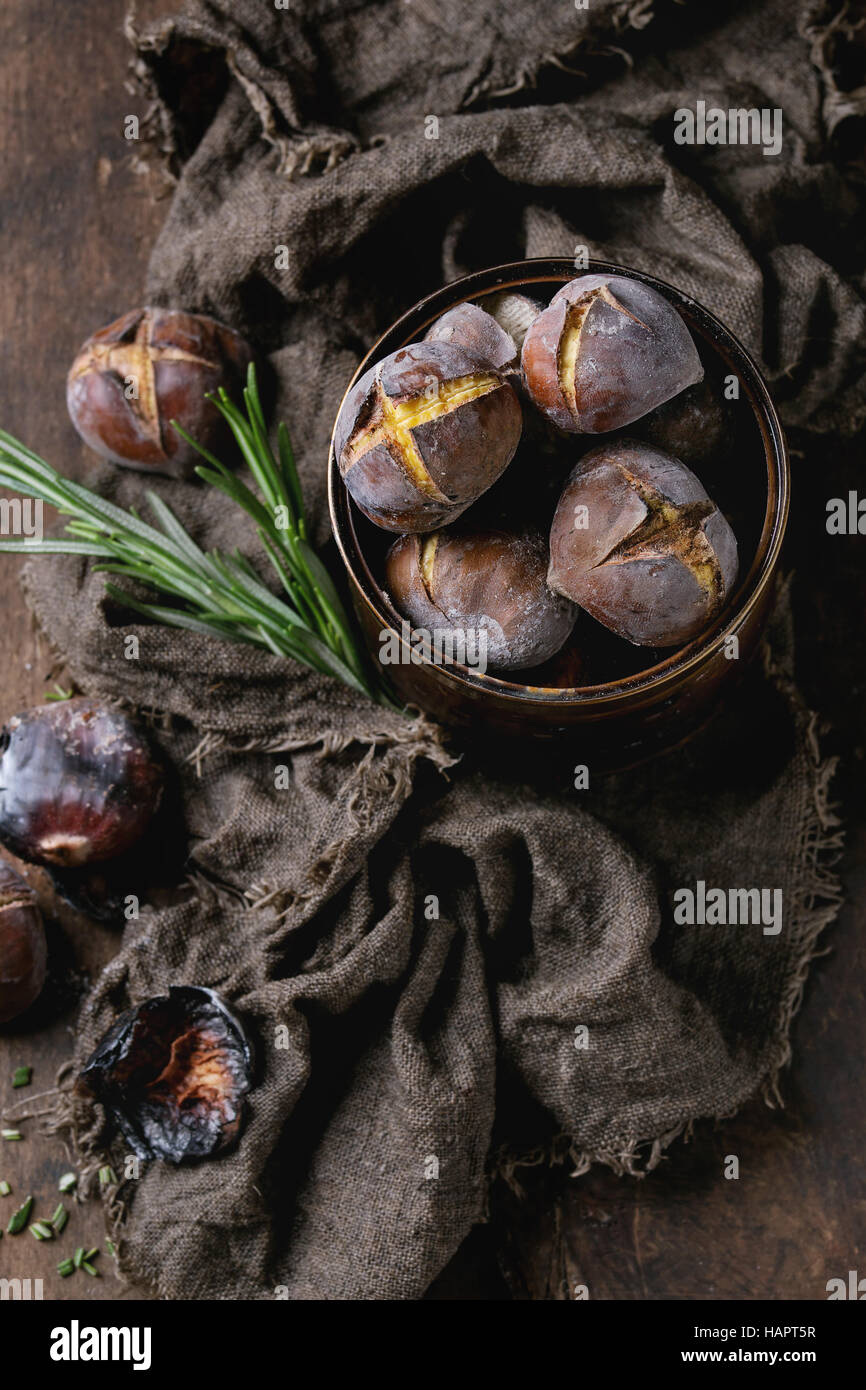 Roasted chestnuts in the ashes Stock Photo