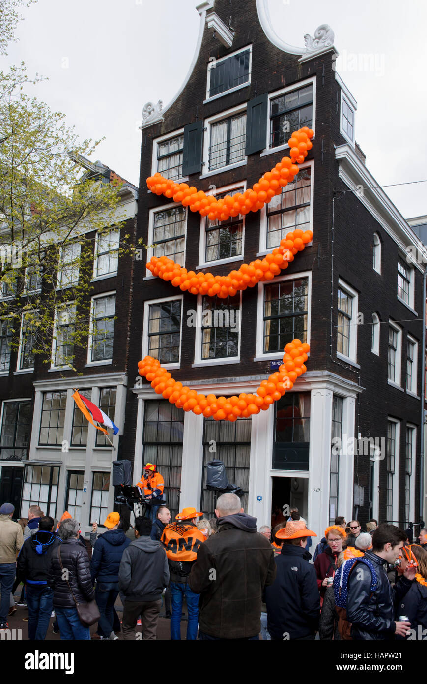 A building decorated with orange coloured balloons during the King's