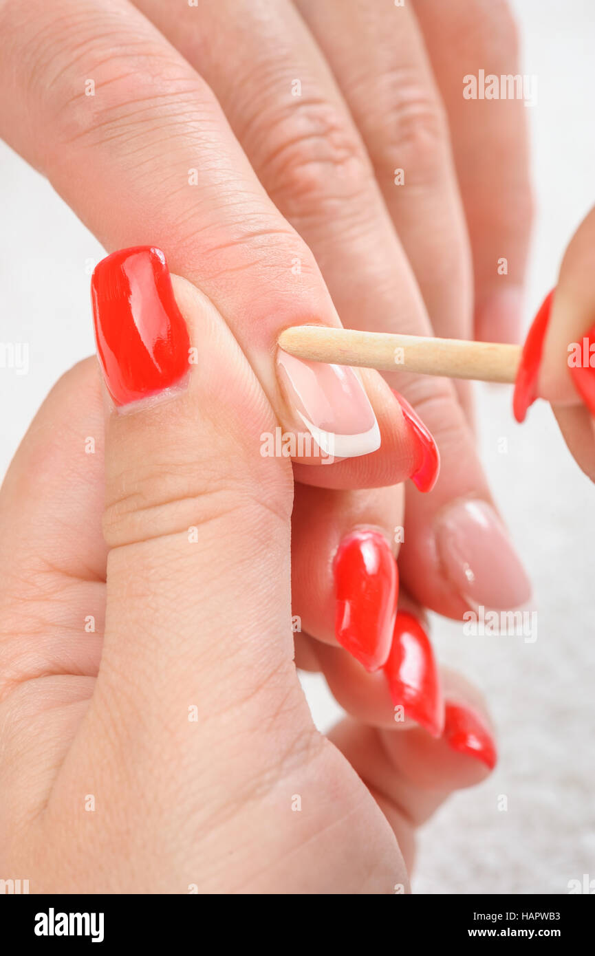 Cuticles care with cuticle pusher Stock Photo Alamy