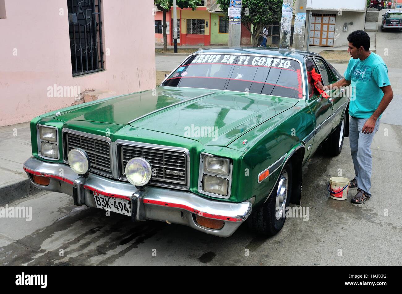 Washing classic car Dodge in TUMBES. Department of Tumbes .PERU Stock