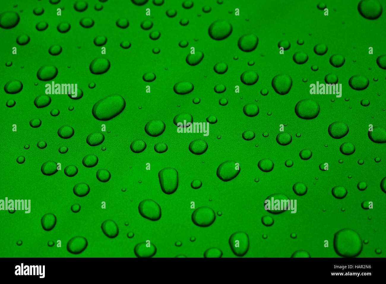 rain drops on green car paint threated with hydrophobic coating Stock Photo