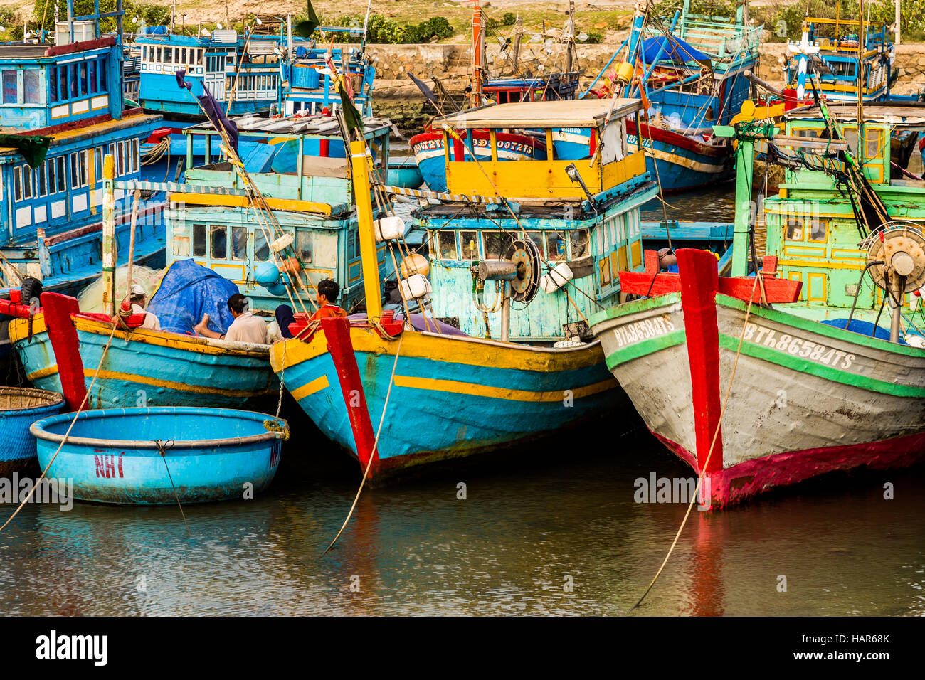 Vietnamese fishing boats in a harbor Stock Photo - Alamy