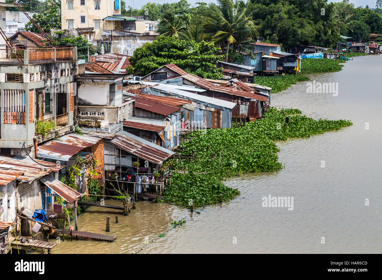 Vietnamese shanty town next to a river Stock Photo - Alamy