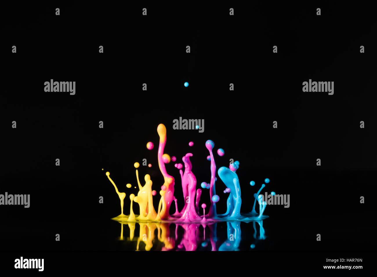 splashing color ink on black background Stock Photo