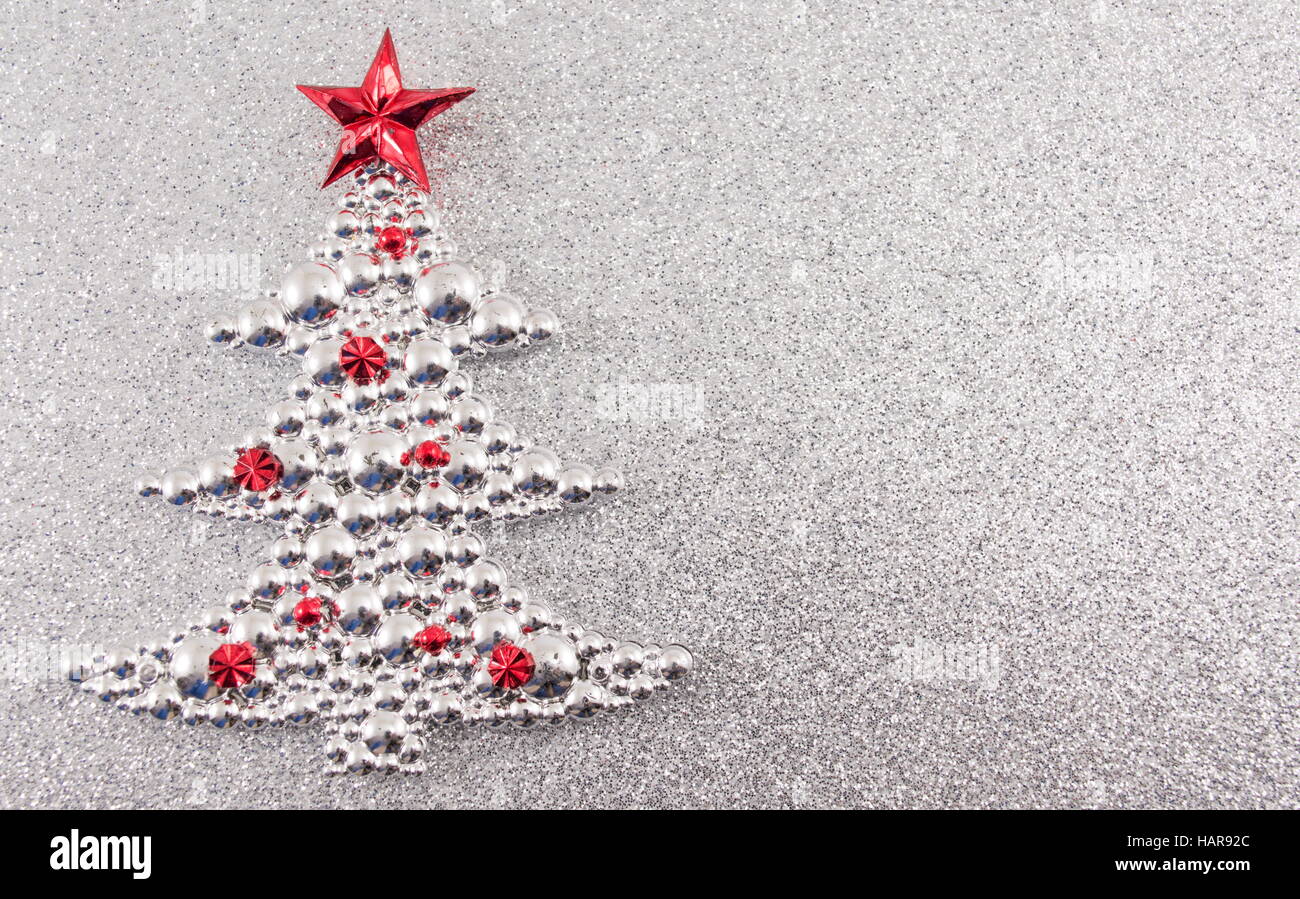 Christmas tree decoration with silver glitter background. Celebrating Christmas Stock Photo