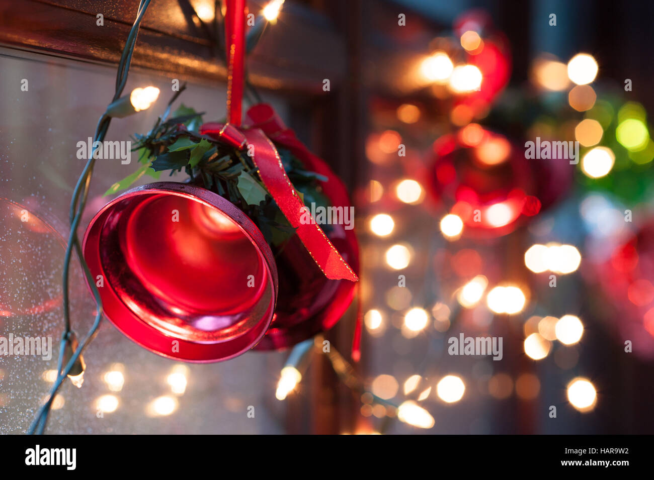 Christmas bells red on window Stock Photo