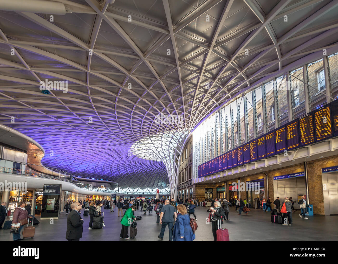 london-people-in-front-of-the-electronic-panels-with-arrival-and