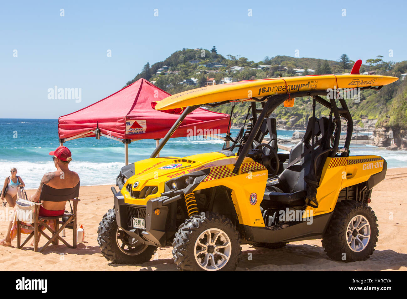 Surf rescue lifeguard seated on Whale Beach Sydney watching for those needing help in the ocean,Australia Stock Photo