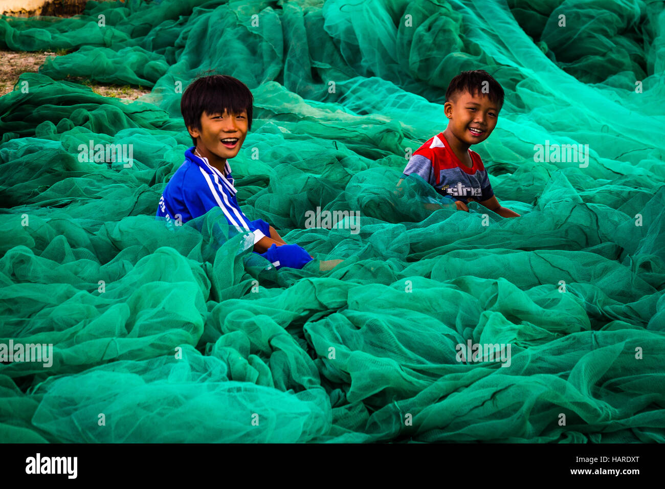 Playing with fishing net hi-res stock photography and images - Alamy