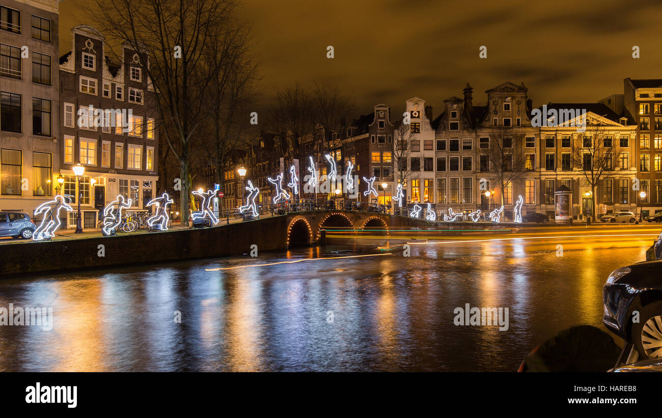 Tour boats leave light trails as they cruise the exhibition "Water
