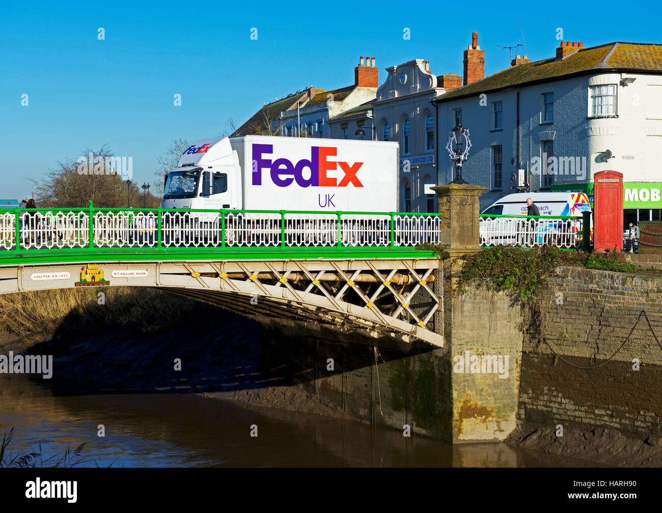 FedEx delivery van crossing bridge over the River Parrett, Bridgwater, Somerset, England UK Stock Photo