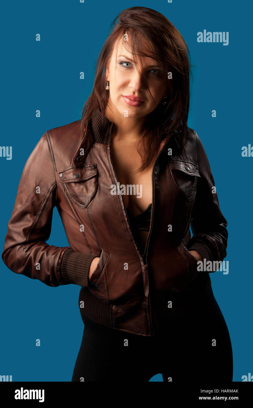 pretty young woman on a blue background Stock Photo - Alamy