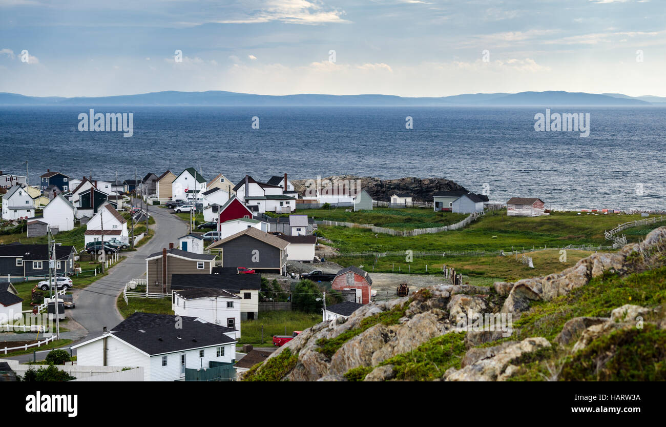 Bonavista, Newfoundland, Canada, on mid summer overcast day.   Village community alongside the sea.  People staying inside. Stock Photo