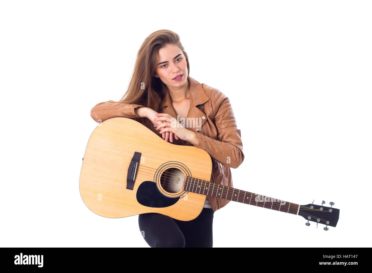 Young woman holding a guitar Stock Photo - Alamy