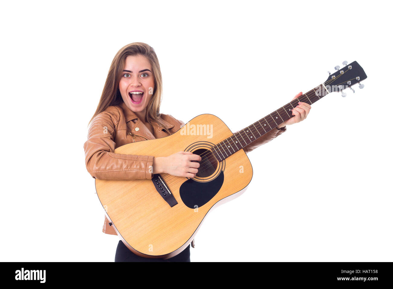 Young woman holding a guitar Stock Photo - Alamy