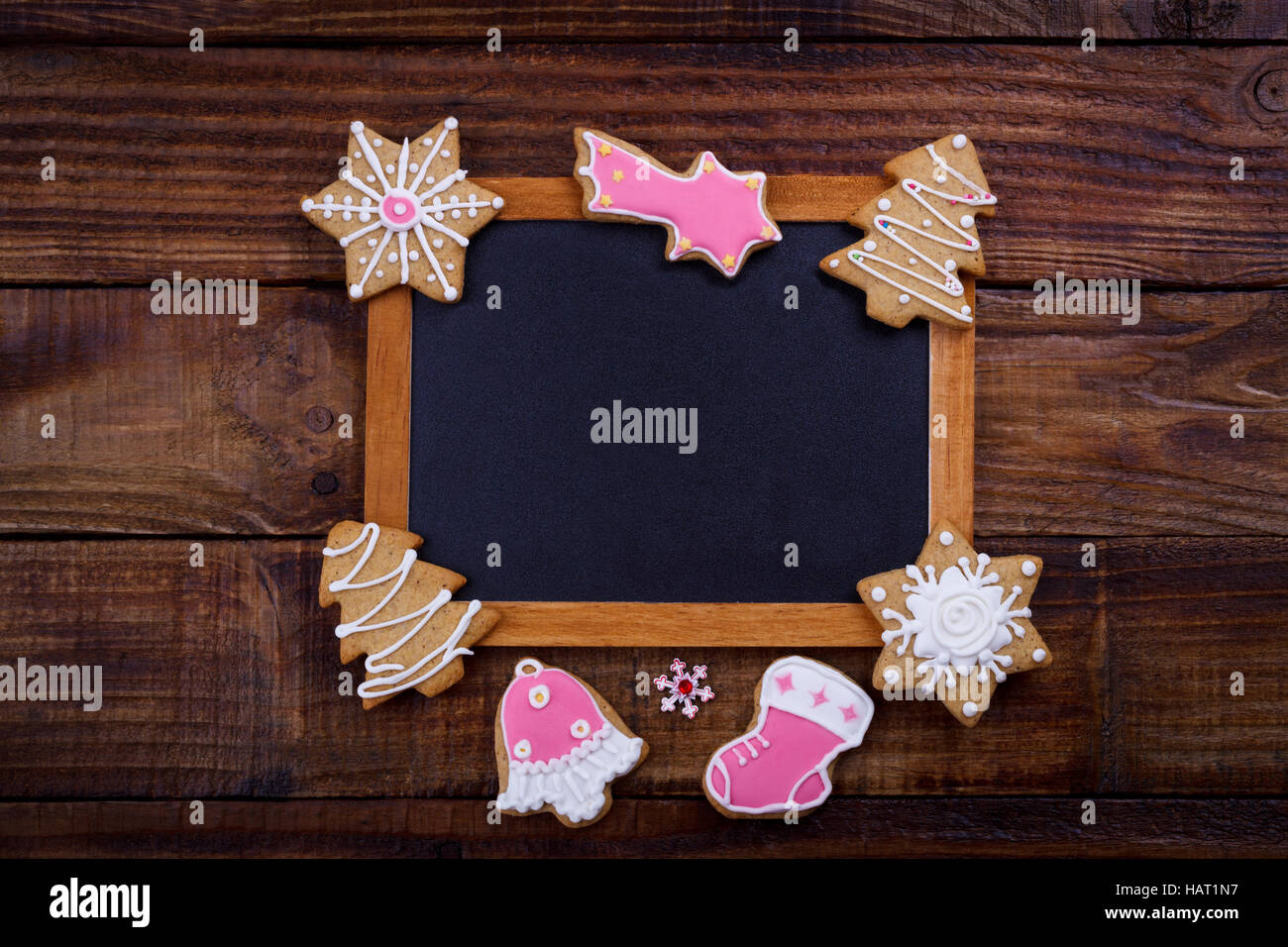 Christmas cookies and vintage black board for text. Holiday background Stock Photo