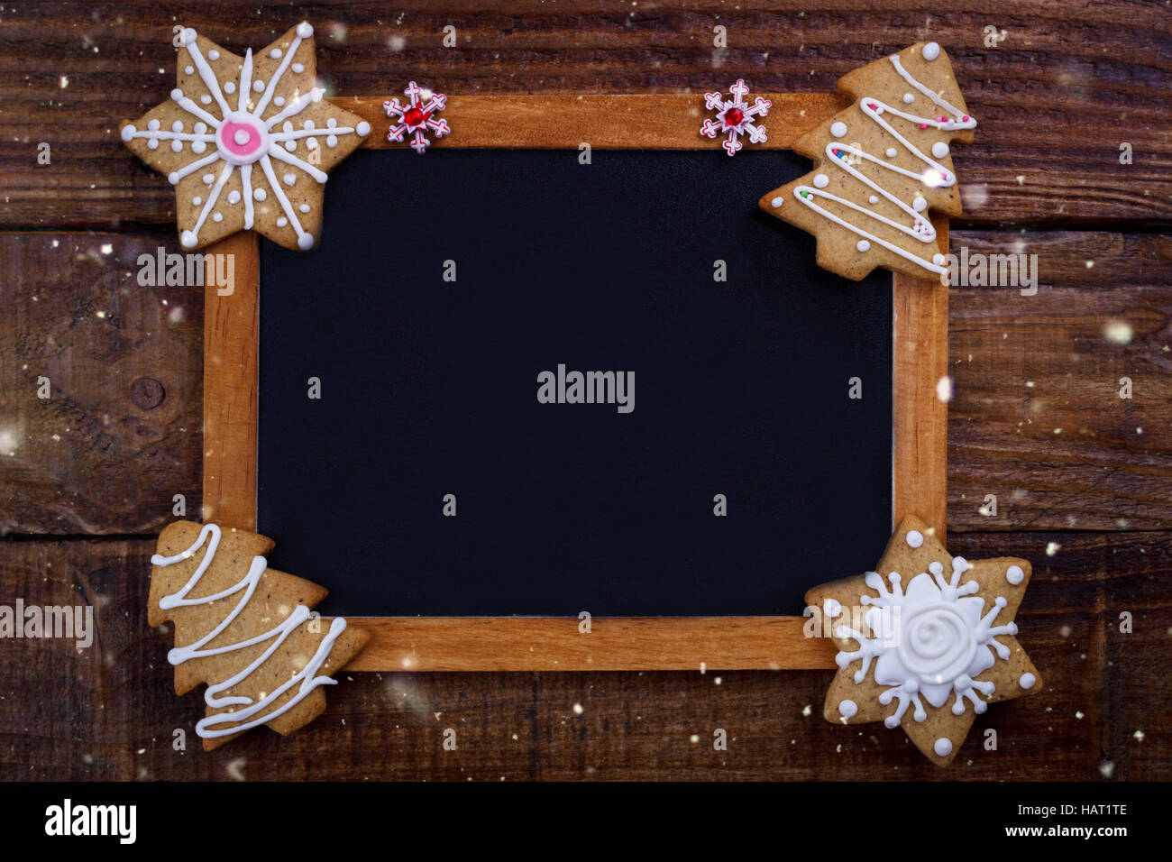 Christmas cookies and vintage black board for text. Holiday background Stock Photo