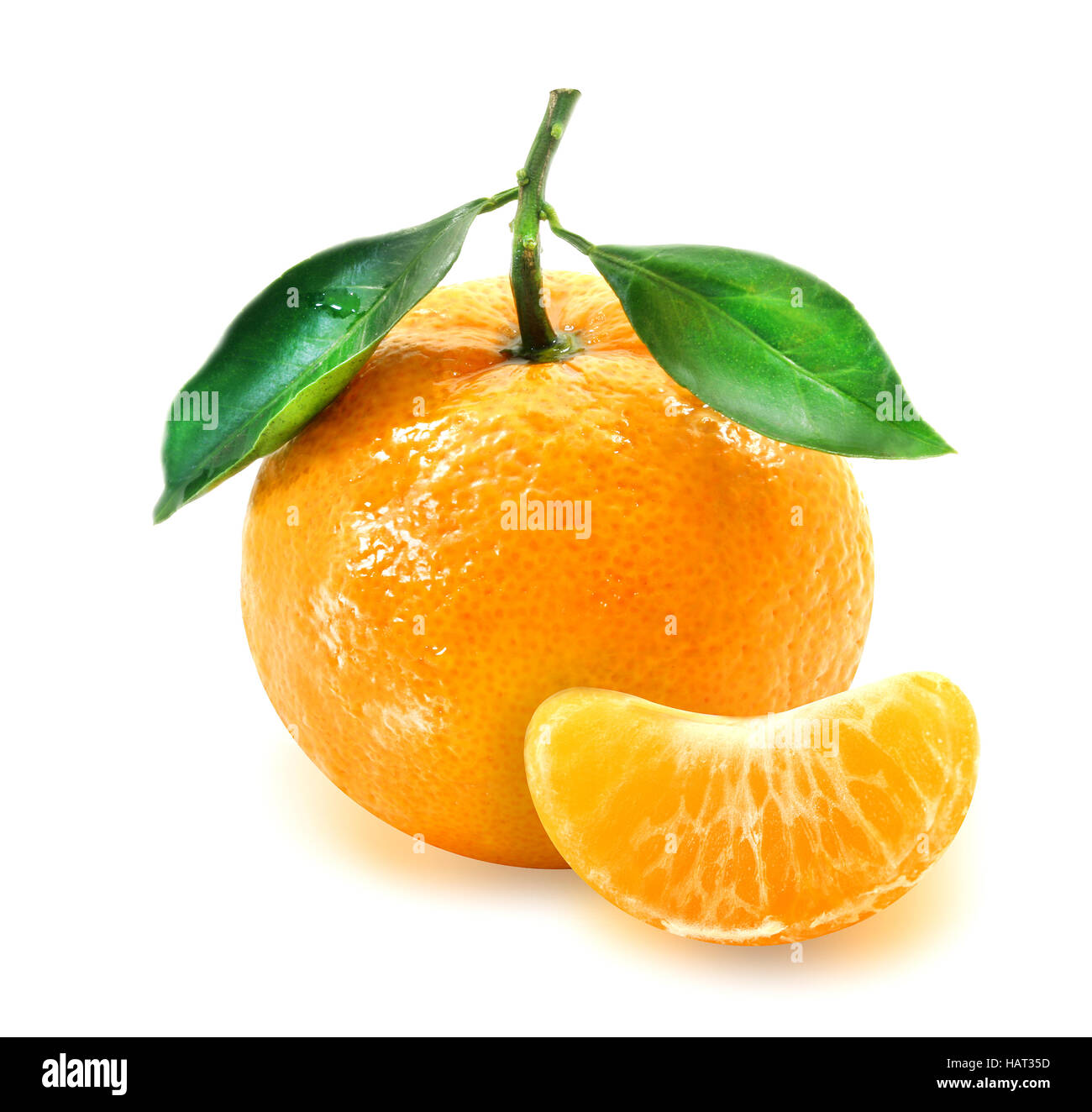 Photos bright tangerine with a slice isolated on white background Stock