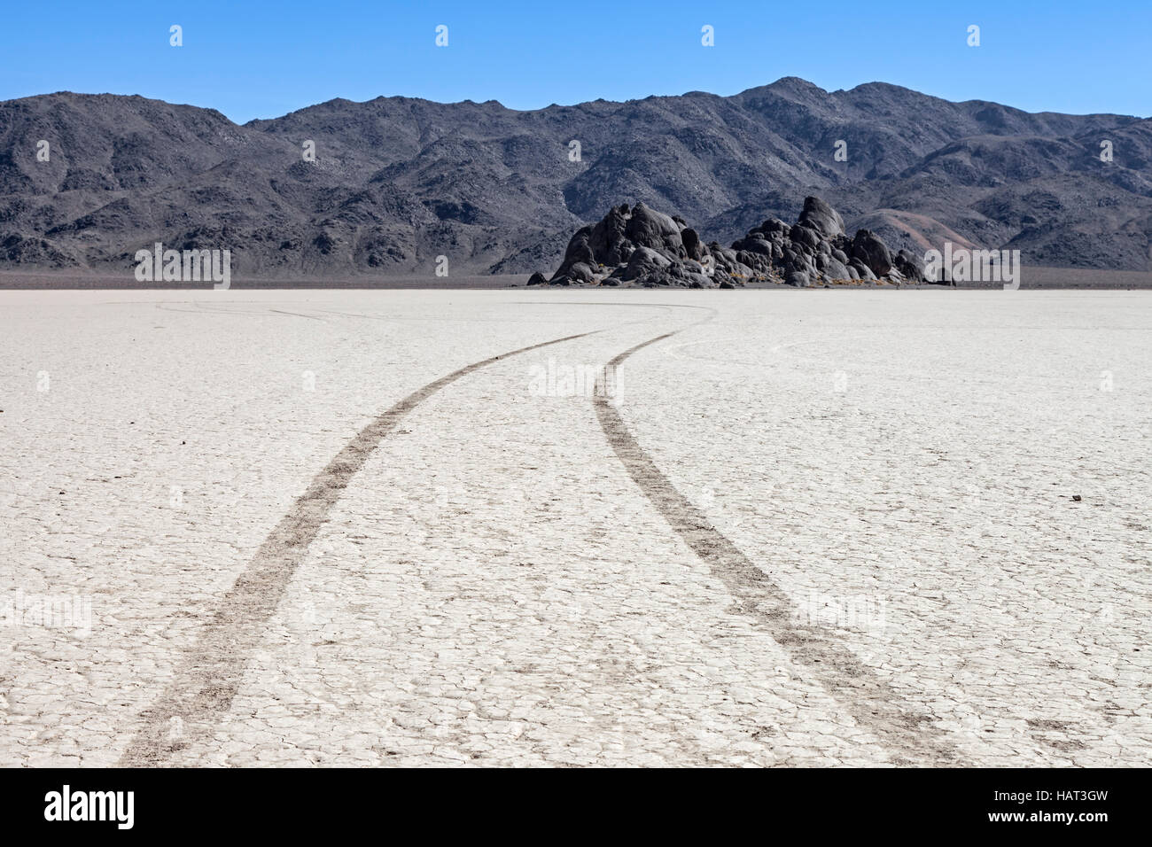Tier tracks scar the fragile floor near the Grandstands on the Racetrack Playa in Death Valley National Park Stock Photo
