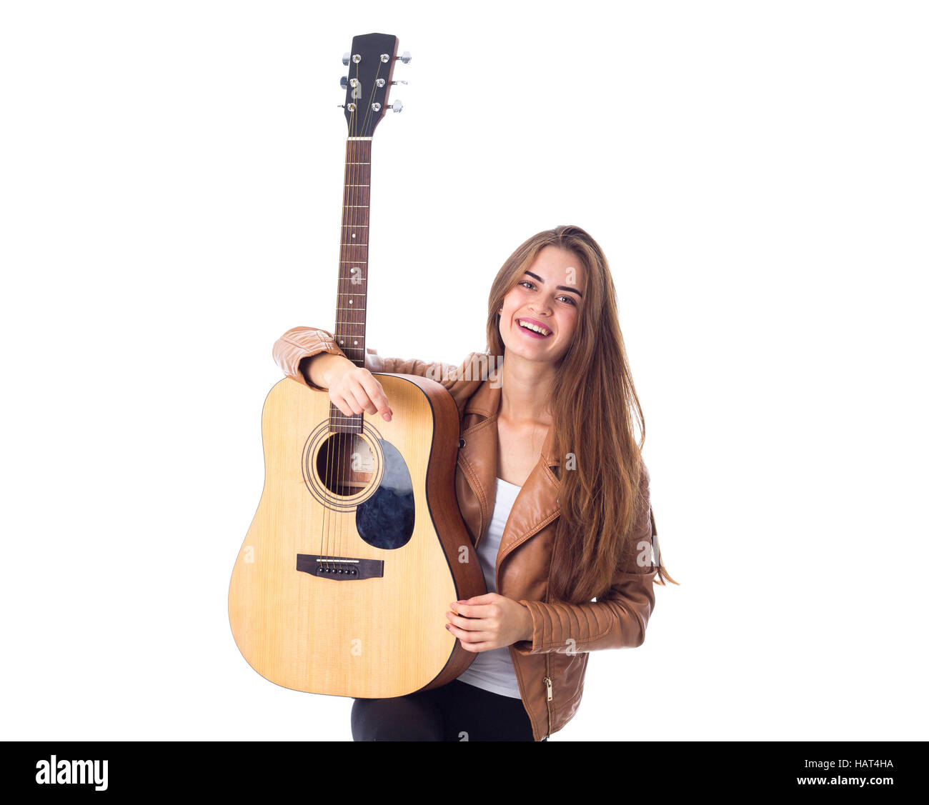 Young woman holding a guitar Stock Photo - Alamy