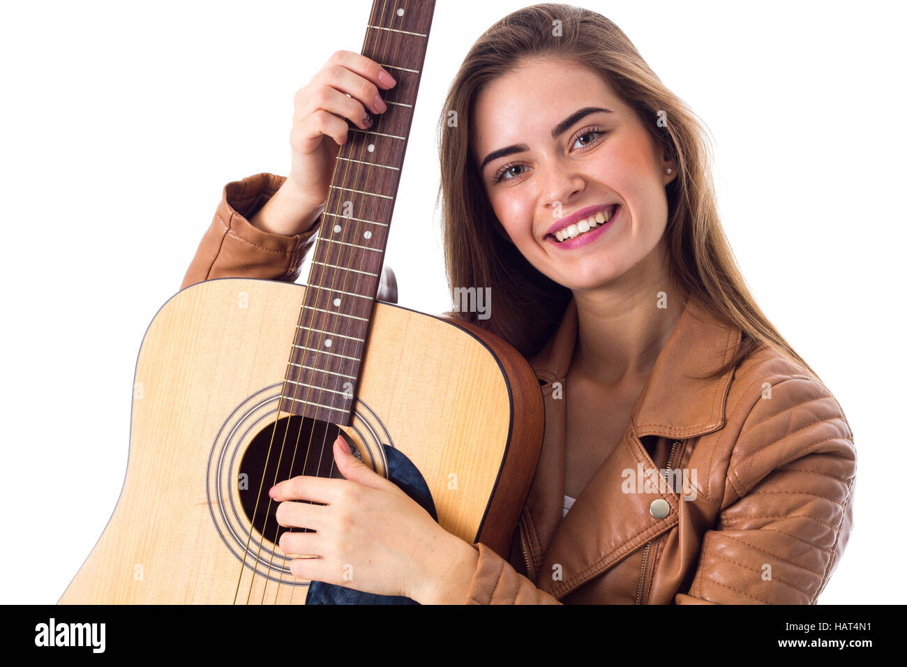 Young woman holding a guitar Stock Photo - Alamy