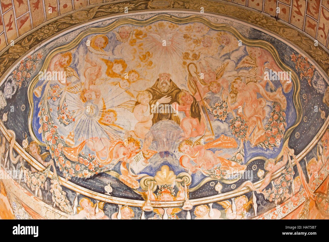 AVILA, SPAIN, APRIL - 19, 2016: The baroque fresco of St. Benedict of Nursia in church Basilica de San Vicente and apse of side  chapel. Stock Photo