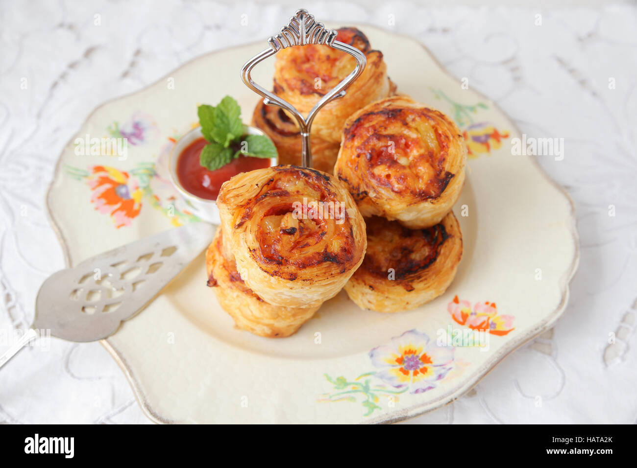 mini pizza rolls on vintage serving plate Stock Photo