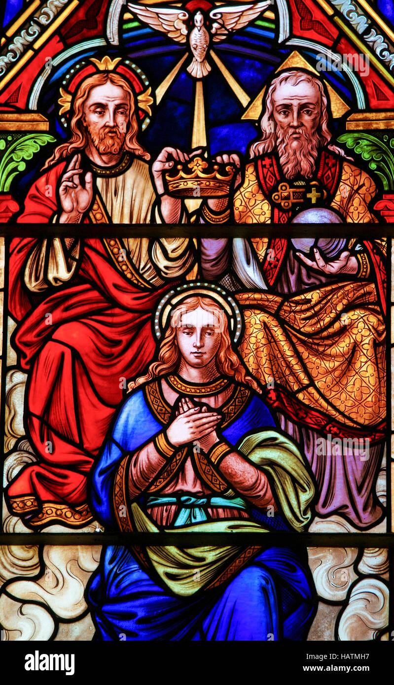 Stained glass church window in the Church of Bariloche, Argentina, depicting the Coronation of Mother Mary by the Holy Trinity Stock Photo