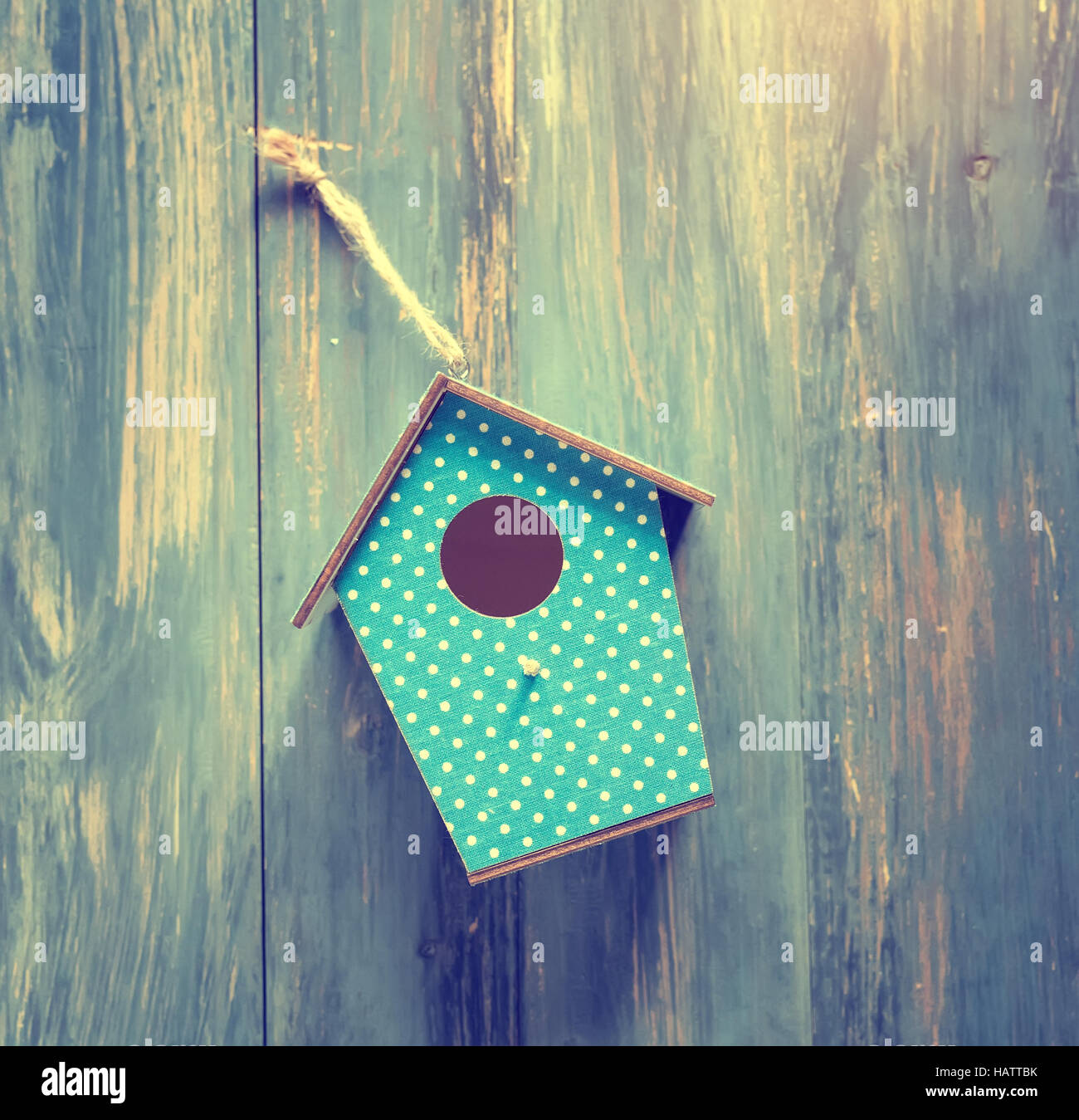 birdhouse on antique rustic wood background Stock Photo - Alamy
