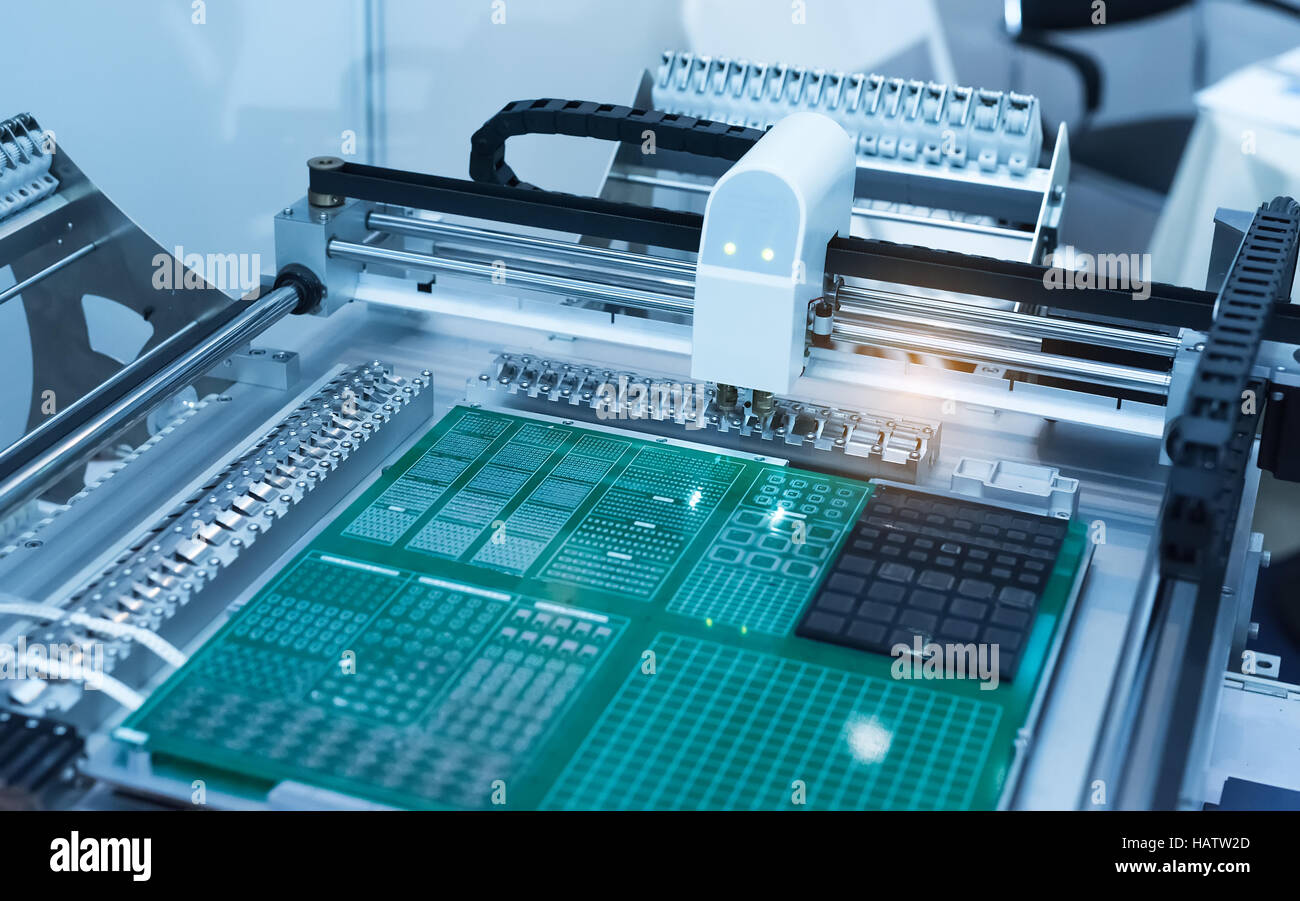PCB Processing on CNC machine,Production of electronic components at high-tech factory Stock Photo