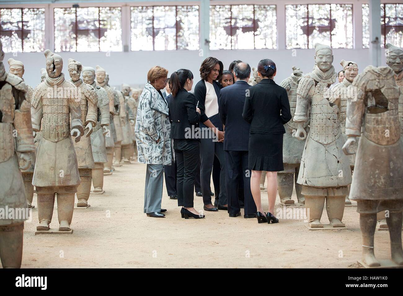 U.S. First Lady Michelle Obama and daughters Sasha Obama and Malia Obama tour the Terra Cotta Warriors March 24, 2014 in Xian, Shaanxi Province, China. Stock Photo