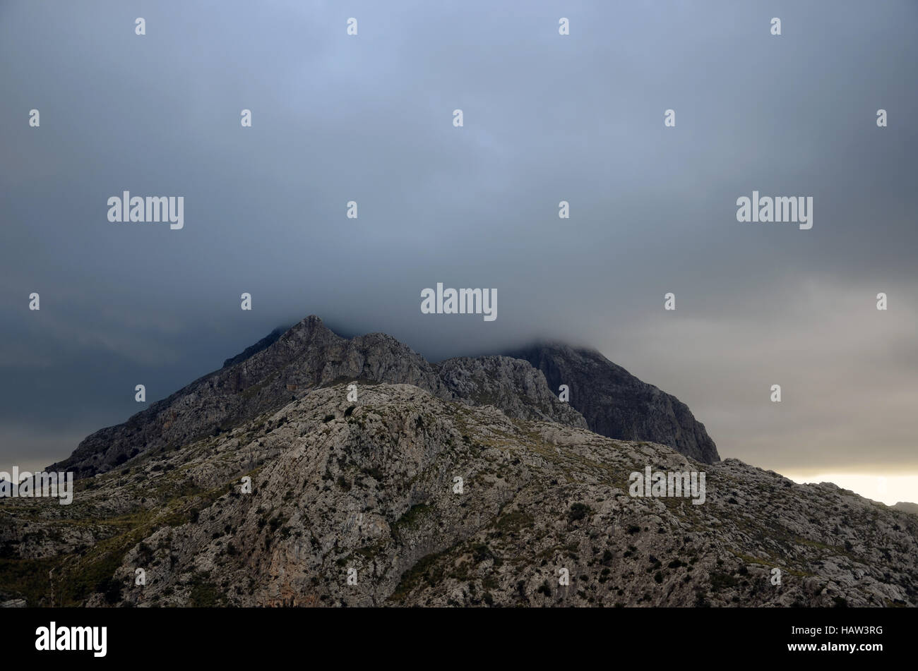 mountaintop shrouded in cloud Stock Photo