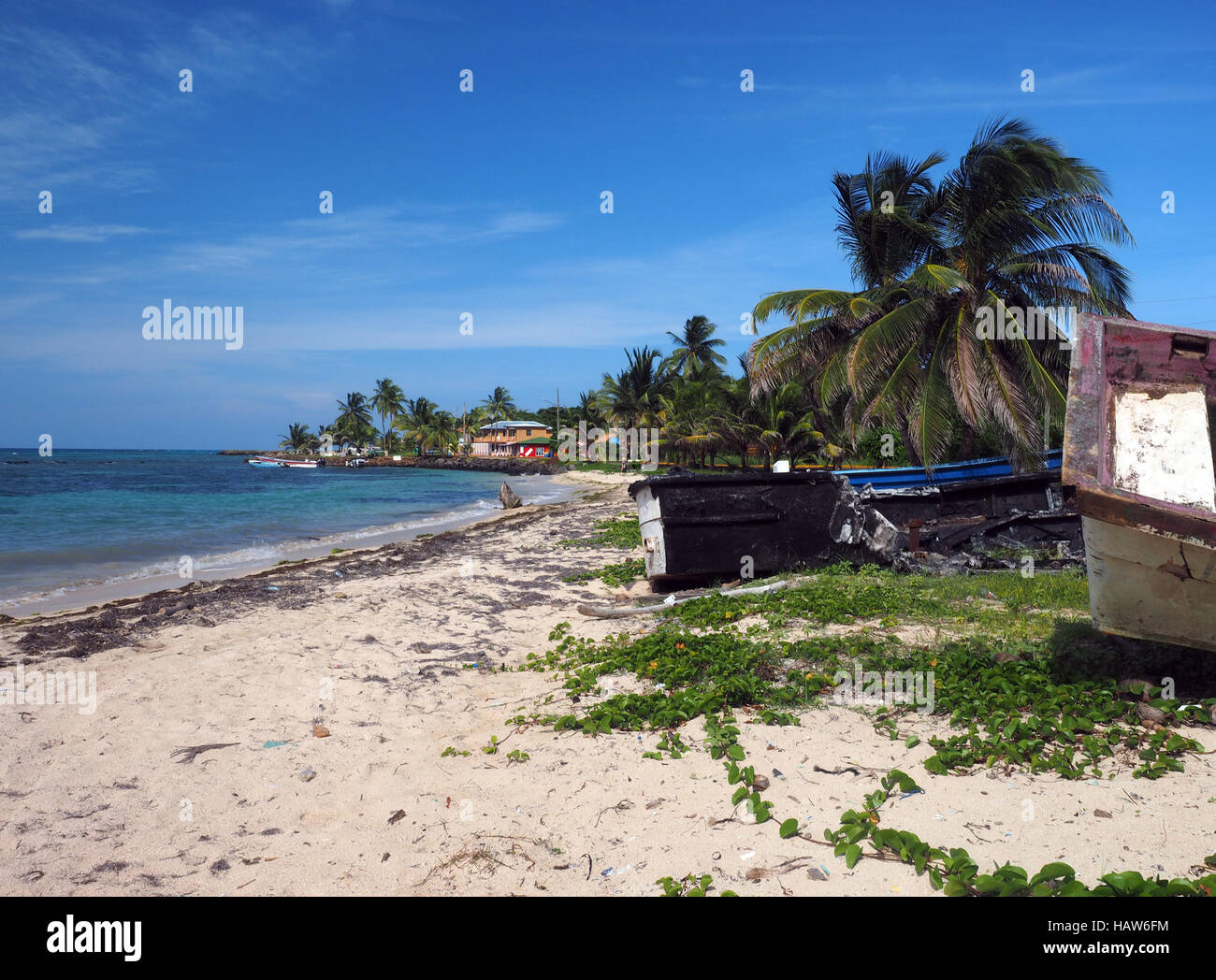 North End Beach Big Corn Island Nicaragua with old boats and hotel in background on Caribbean