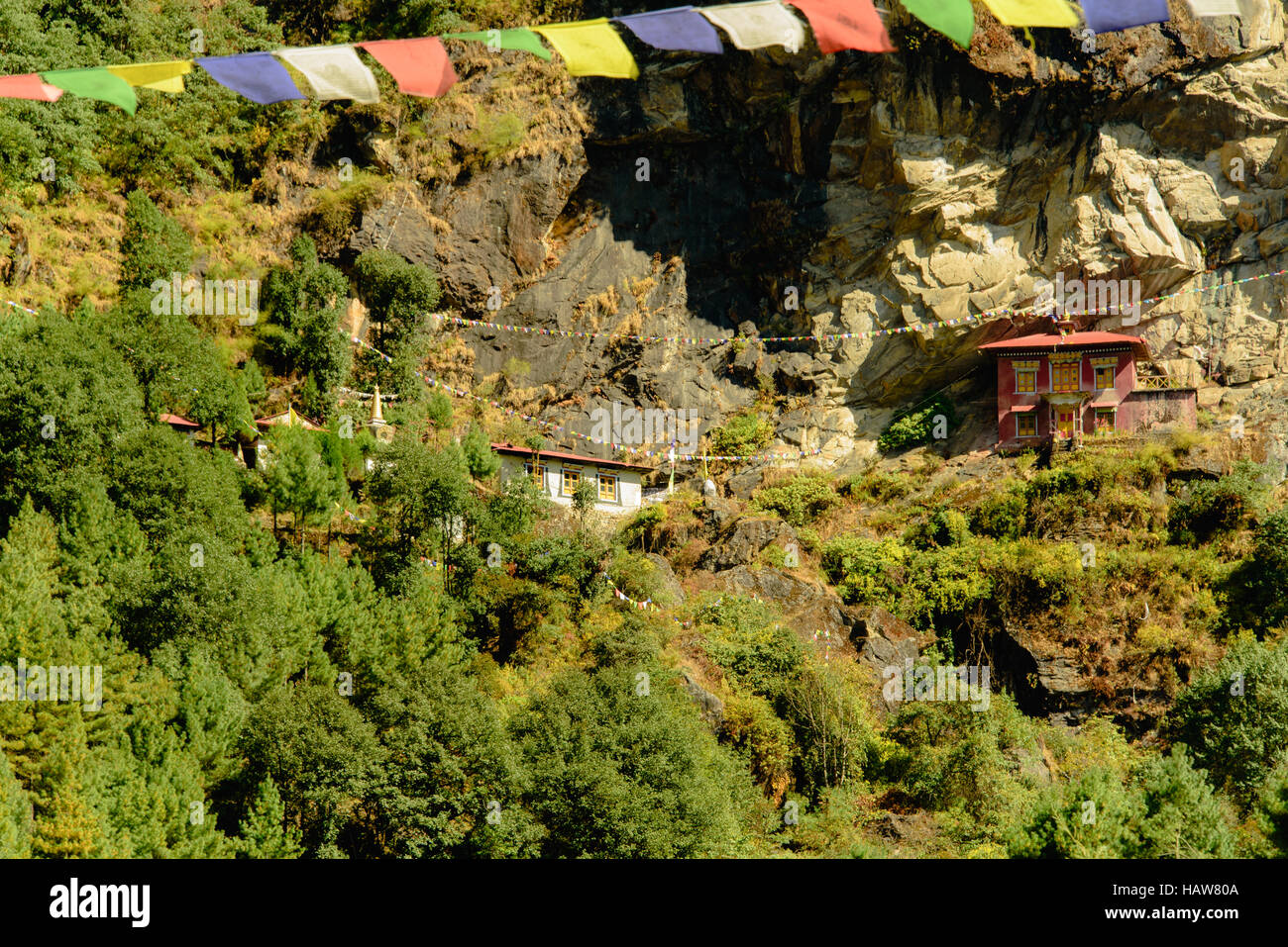 A buddhist temple suspended in the cliffside on a mountain near Phakding in Khumbu region, Himalayas Nepal Stock Photo
