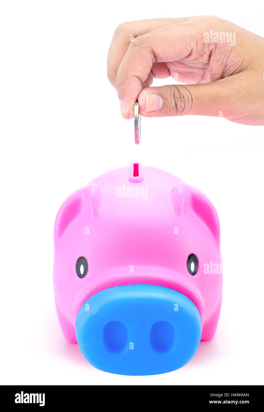 Putting coin into piggy bank Stock Photo