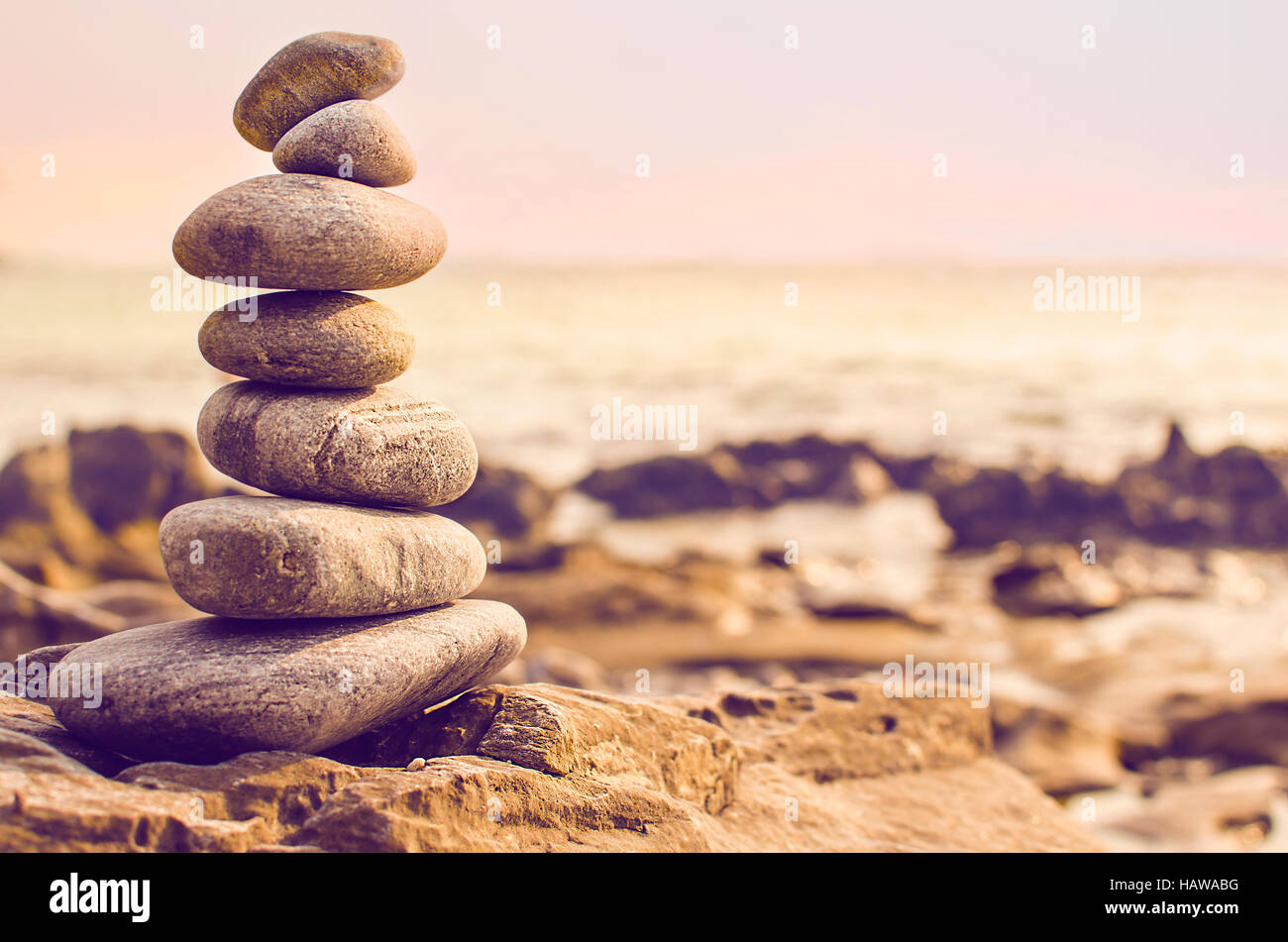 Stones laid out in the form of a pyramid on the seashore Stock Photo