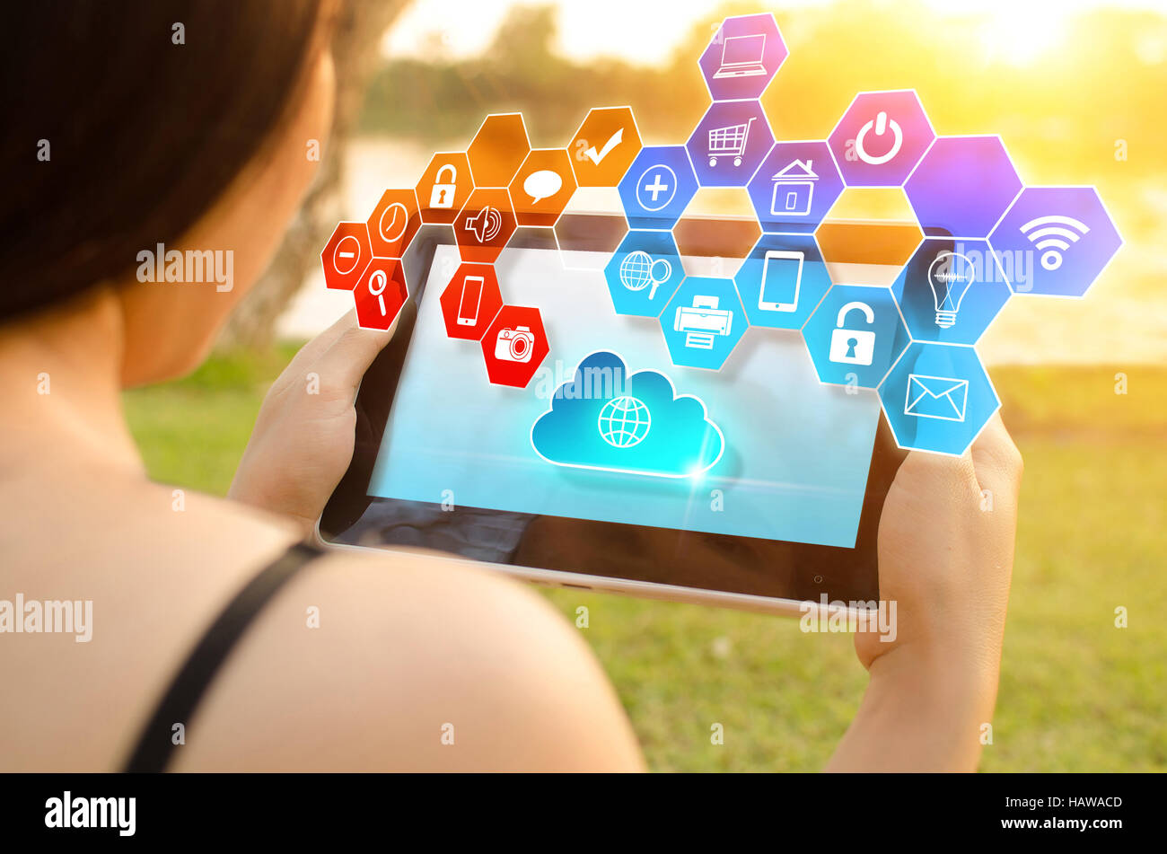 Close up of hand holding tablet with cloud network technology Stock Photo