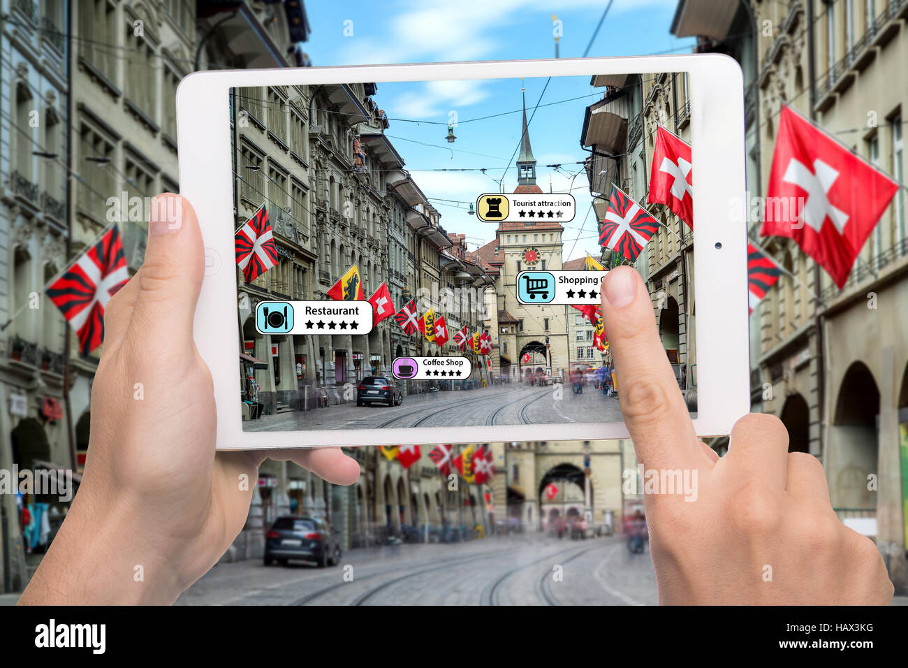 Hand holding smart phone use AR application to check relevant information about the spaces around customer. Bern City in background. Augmented reality Stock Photo