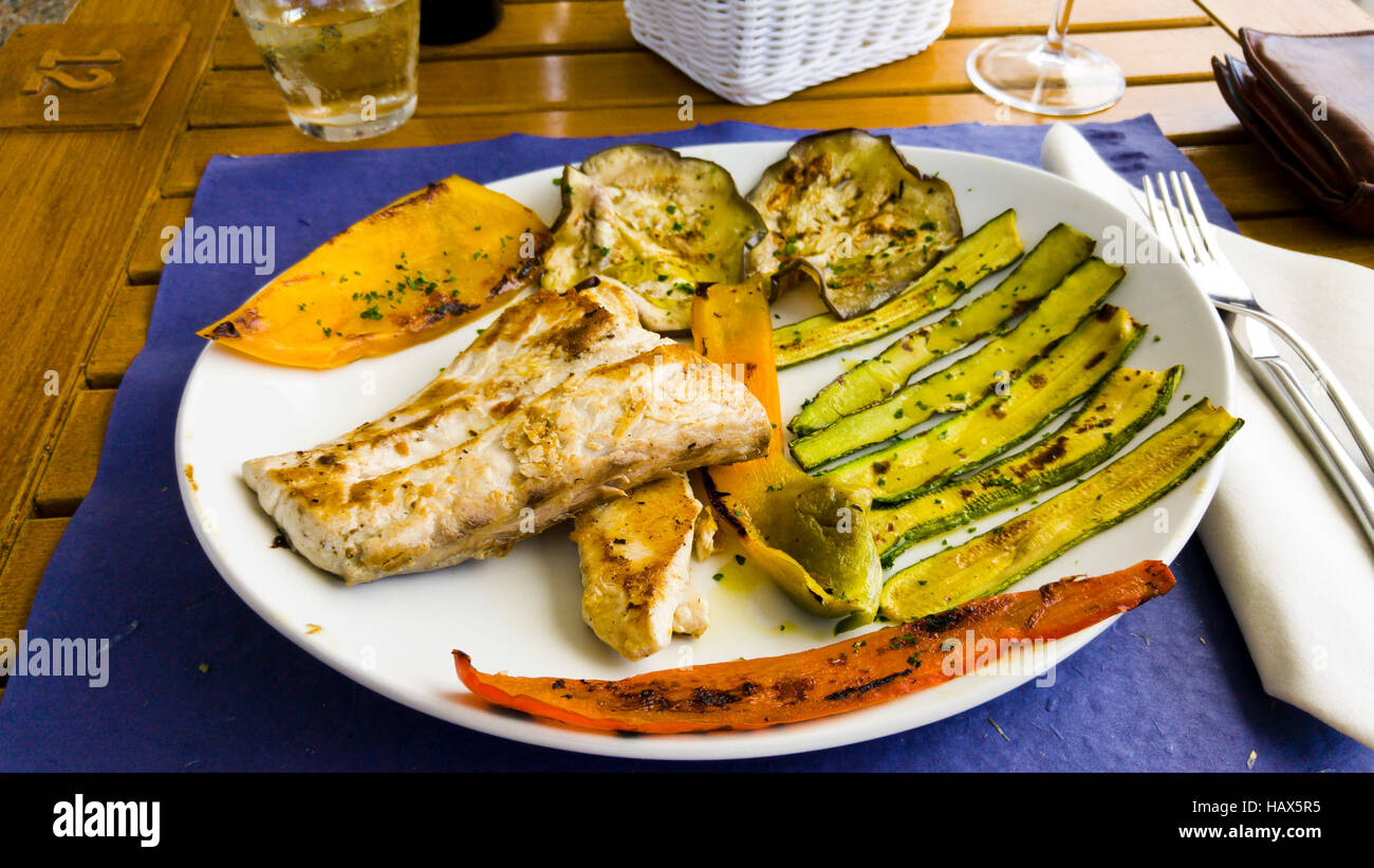 Fish Riciolla Liguria Italy ricciola fish launch plate vegetable food travel Stock ...