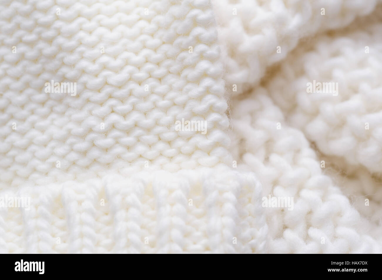 texture of the white knitted scarf and hat Stock Photo