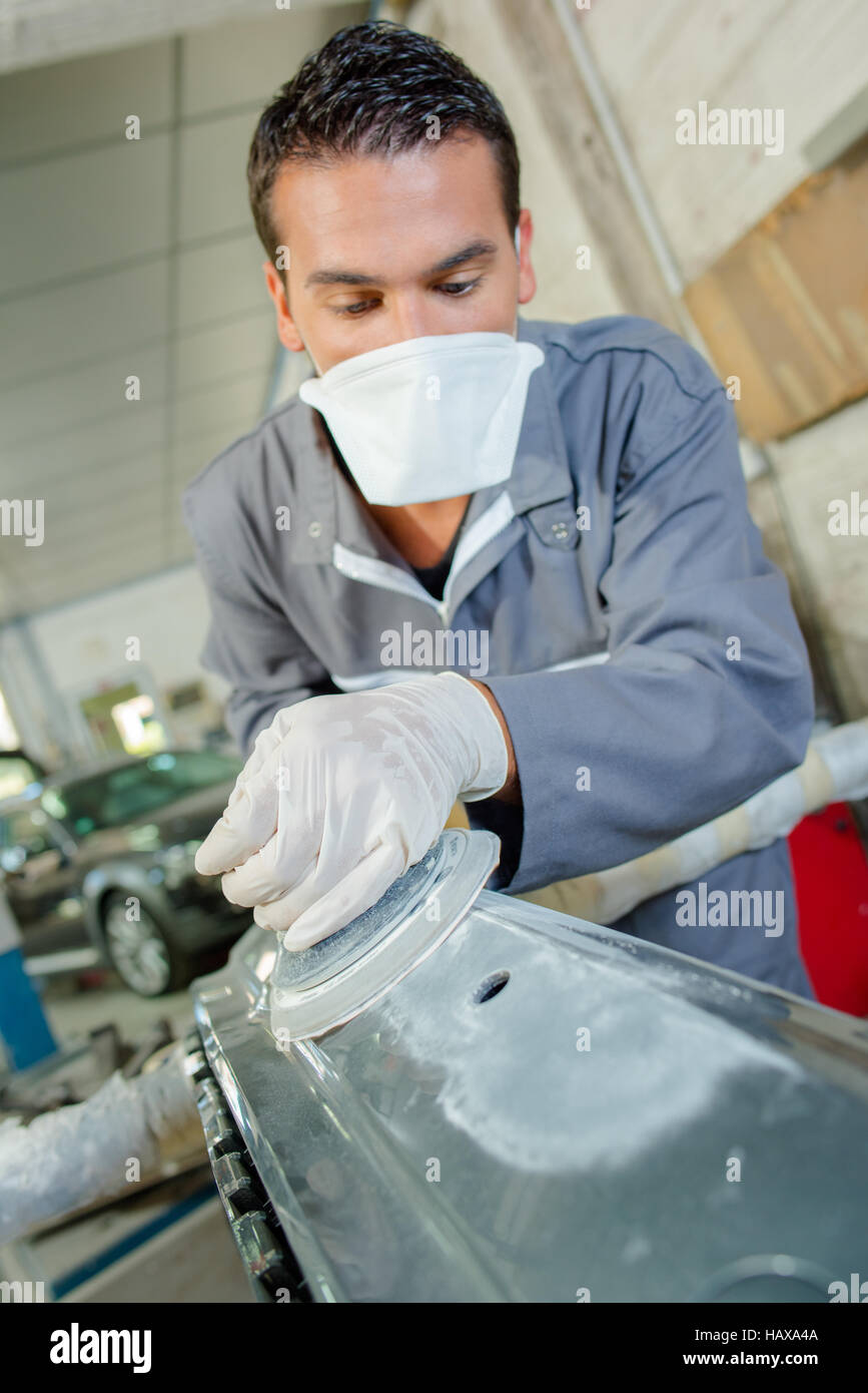Mechanic polishing a bodywork Stock Photo Alamy