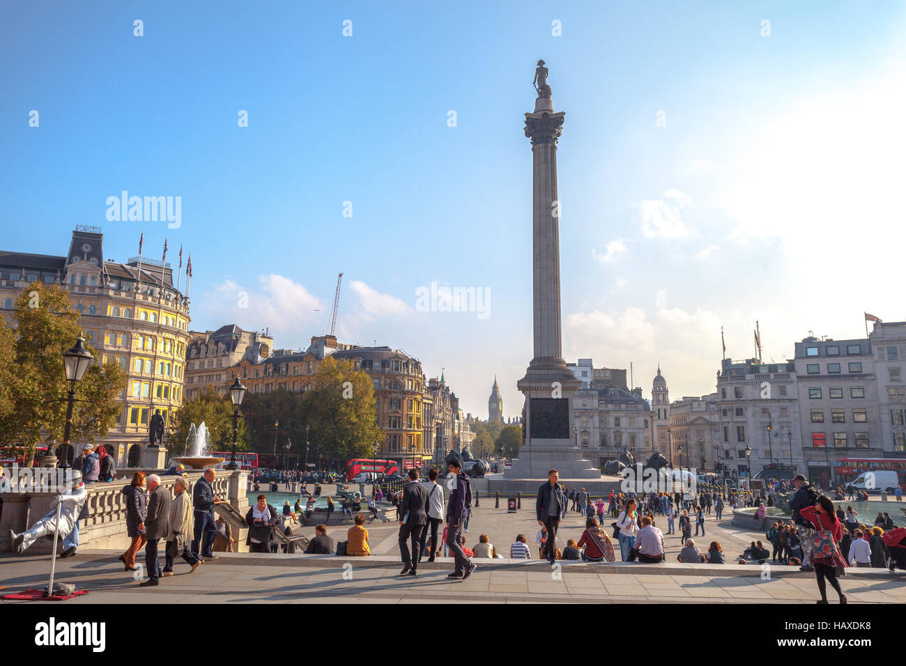London crowd people relaxing in Trafalgar Square Stock Photo