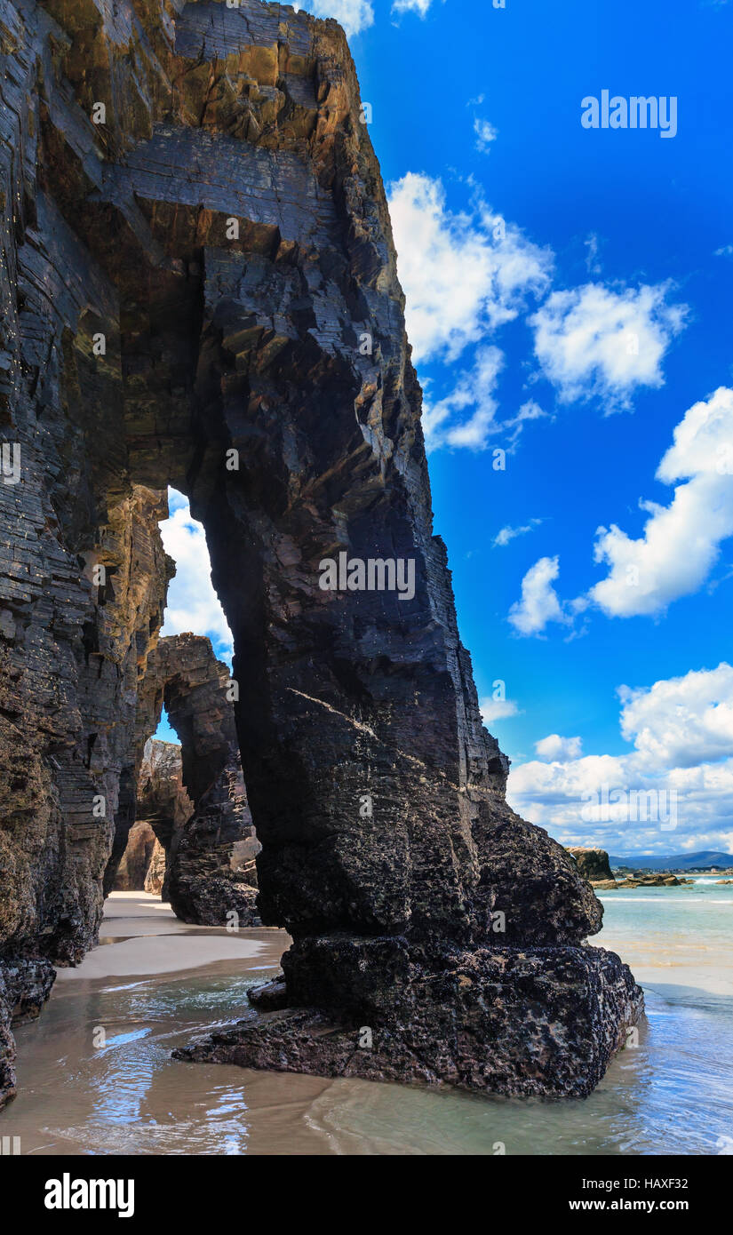 Natural rock arches on Cathedrals beach in low tide (Cantabric coast ...