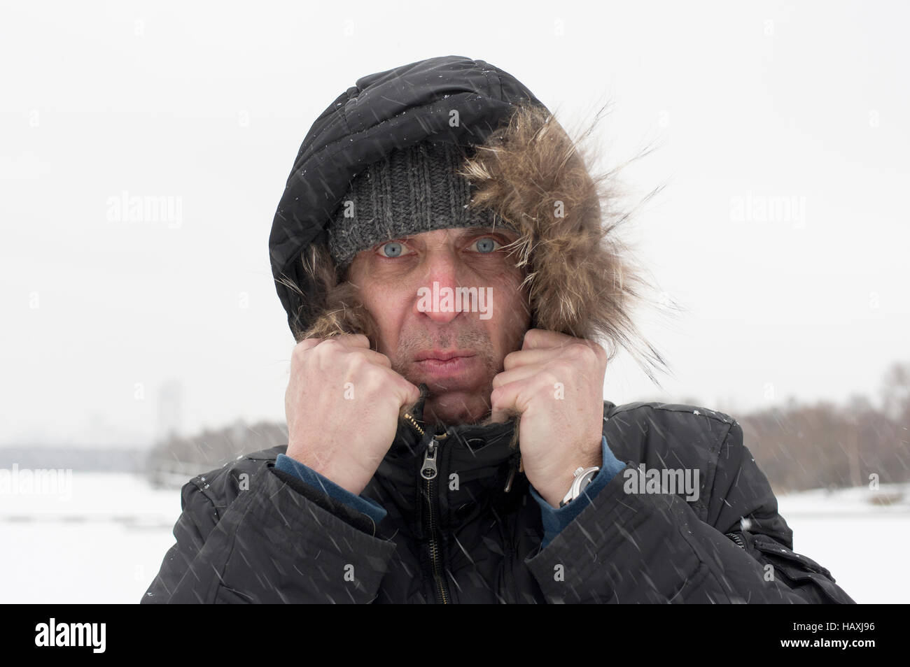 Man Under Snowfall Stock Photo