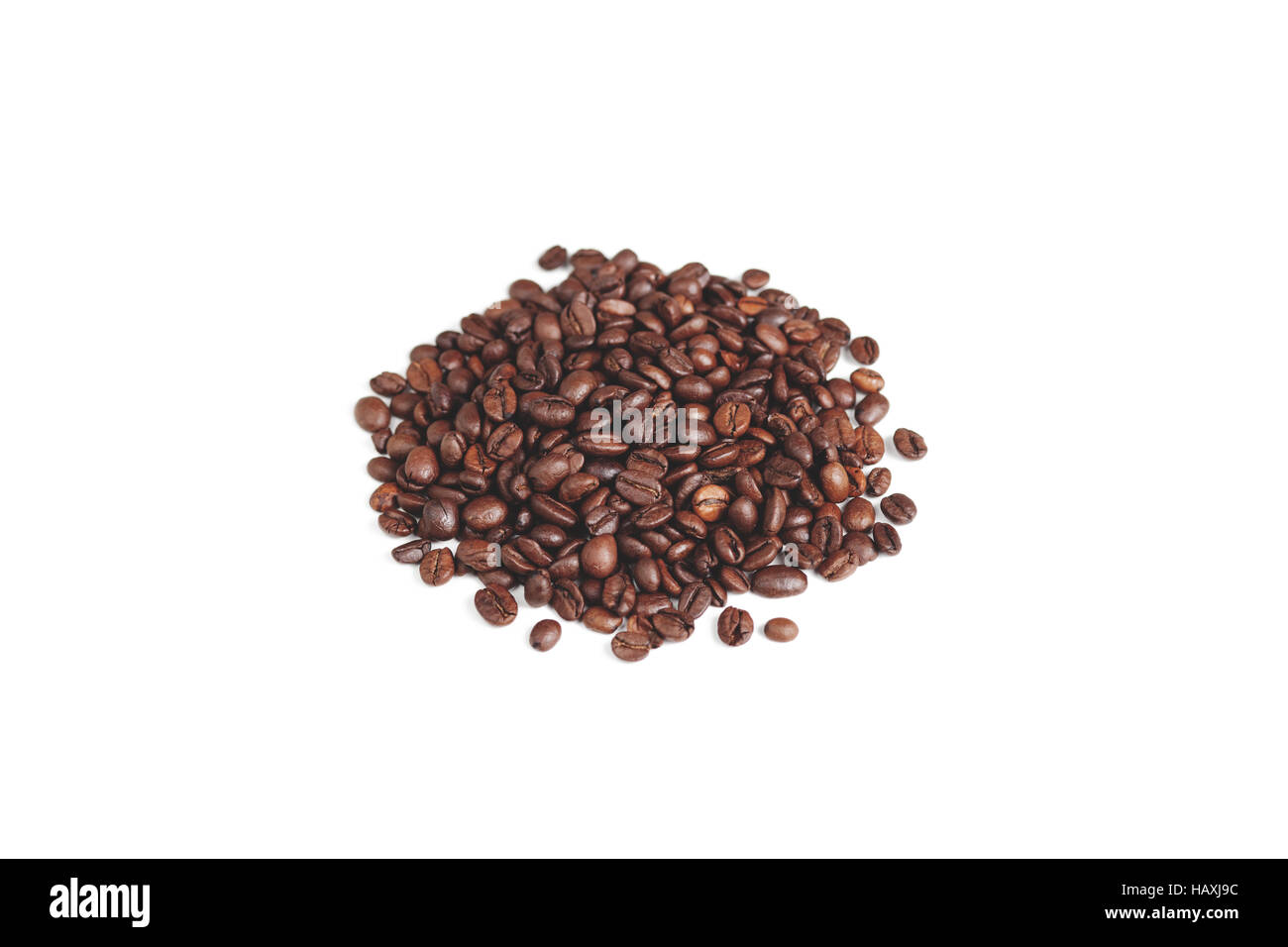 A small pile of coffee beans on a white background Stock Photo - Alamy