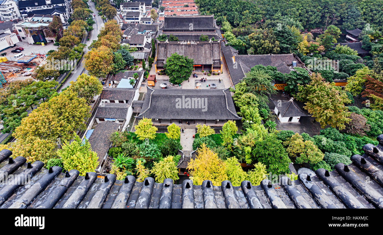 Elevated view from pagoda lookout over historic ancient temple with garden in chinese city Suzhou. Stock Photo