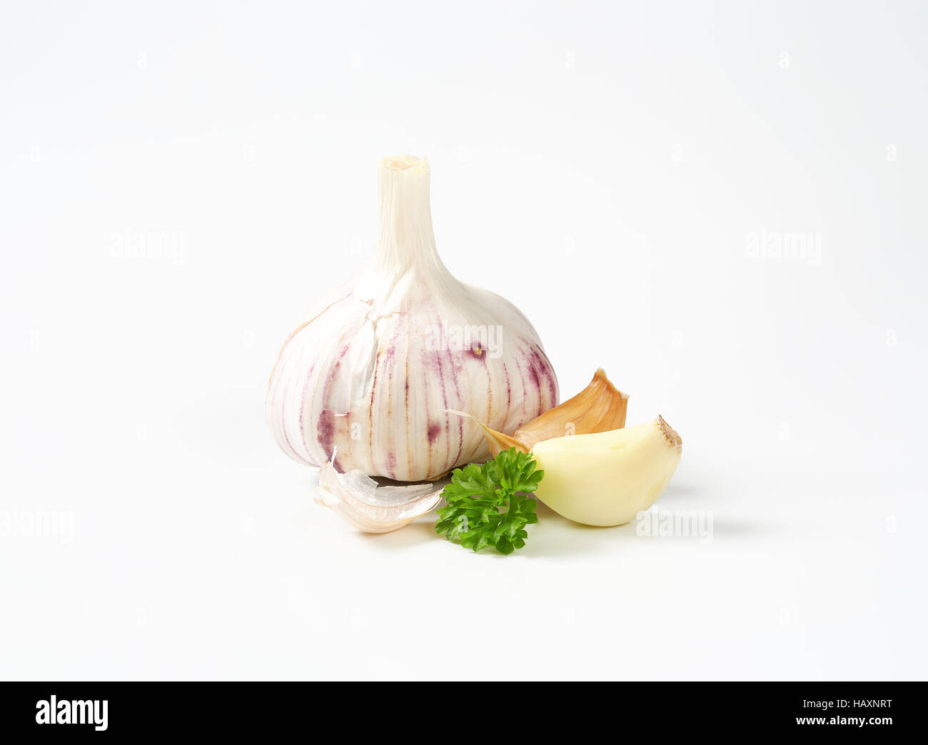 Fresh garlic bulb and cloves on white background Stock Photo - Alamy
