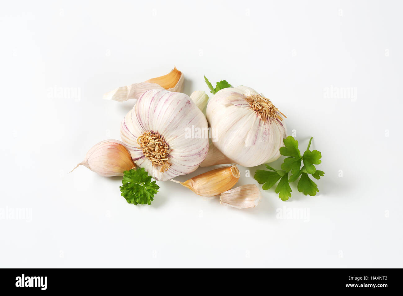 Fresh garlic bulbs and cloves on white background Stock Photo - Alamy